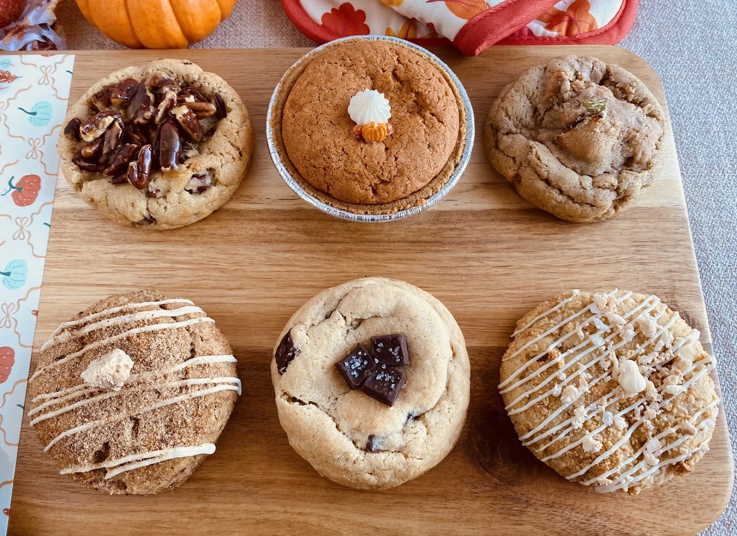 The six Southern Gathering November cookies on a wooden board